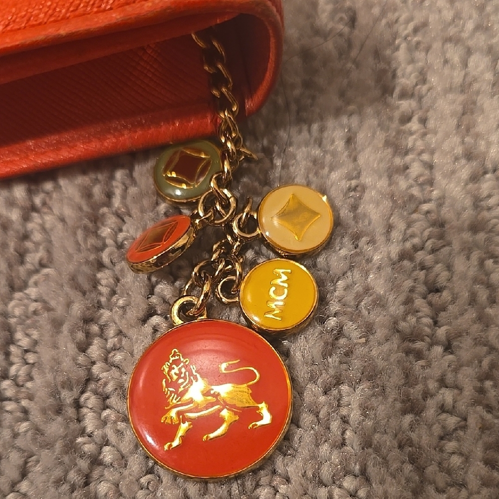 MCM Orange Saffiano Leather Flap Wallet with Gold Accents - Picture 2 of 13